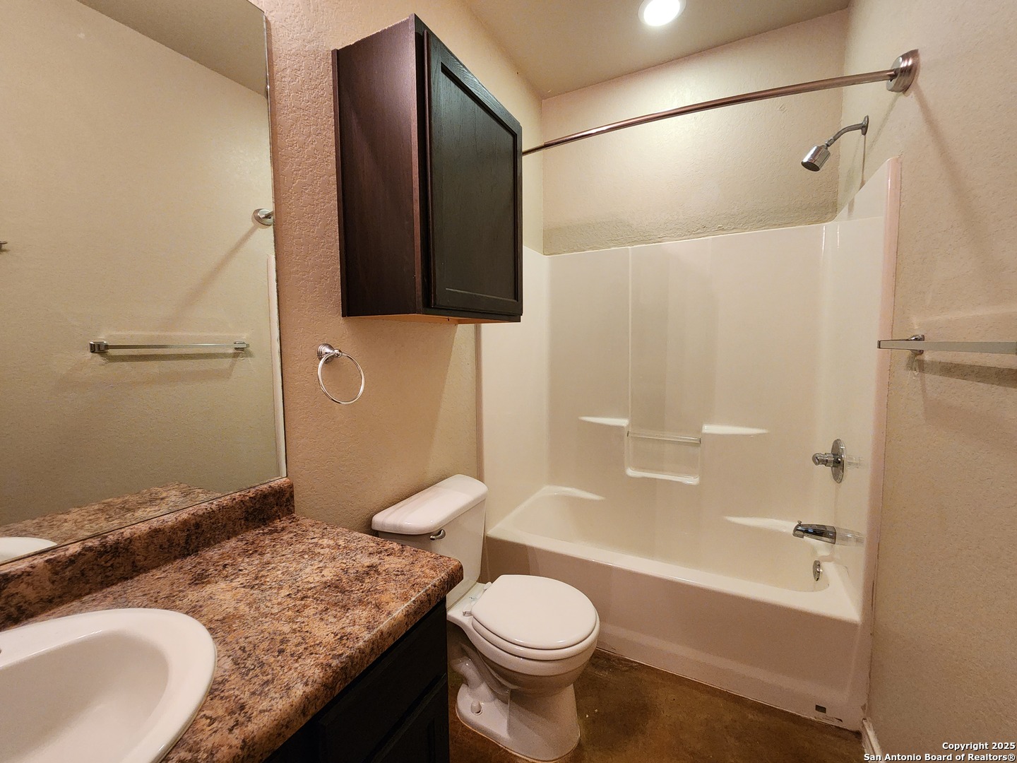 210 Anne Louise Drive New Braunfels, TX 78130 - Photo 10 of 18 a bathroom with a granite countertop toilet sink and mirror