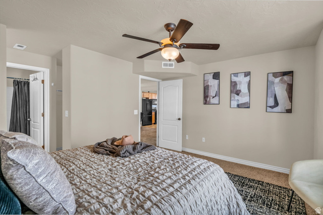 1136 West Spencer Road, Unit Y203 Pleasant Grove, UT 84062 - Photo 15 of 26 Carpeted bedroom featuring freestanding refrigerator and a ceiling fan