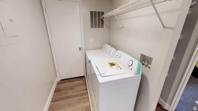 856 East 300 South Provo, UT 84606 - Photo 7 of 9 Laundry room featuring washer and dryer and light wood-style floors