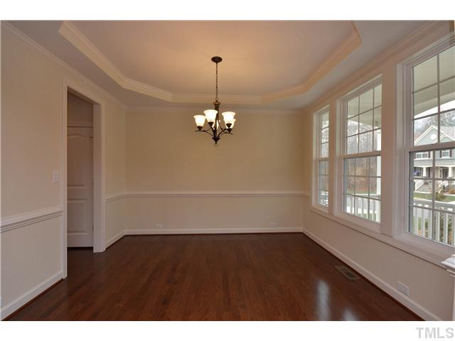 3019 Red Grape Drive Raleigh, NC 27607 - Photo 8 of 22 a view of a room with wooden floor and windows