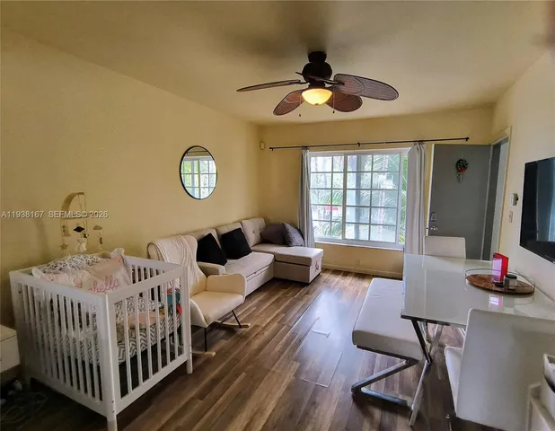 a bedroom with furniture and a window