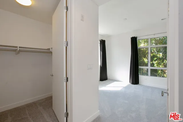 a view of empty room with floor to ceiling window