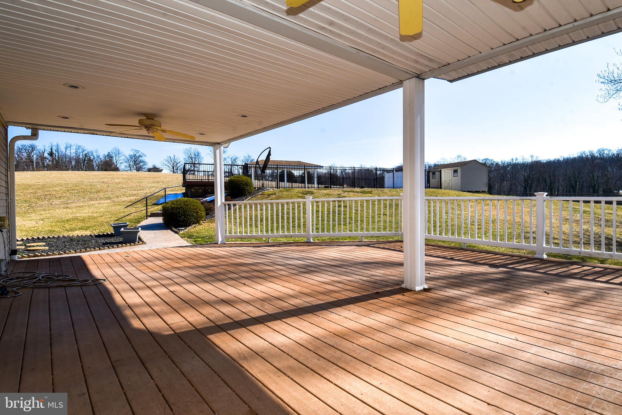 27111 Purdum Road Damascus, MD 20872 - Photo 53 of 84 DECK HAS WALKWAY TO EXTERIOR POOL