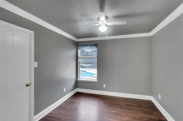 a view of a balcony with a yard