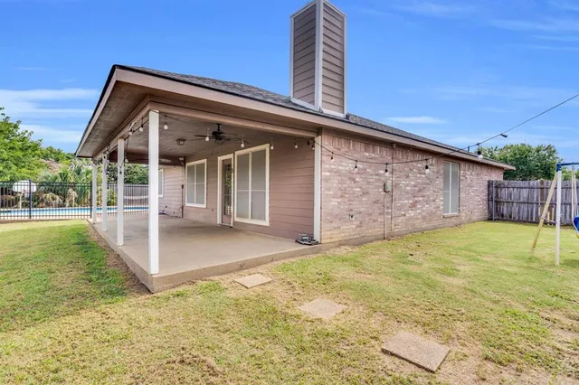 a view of backyard with small cabin