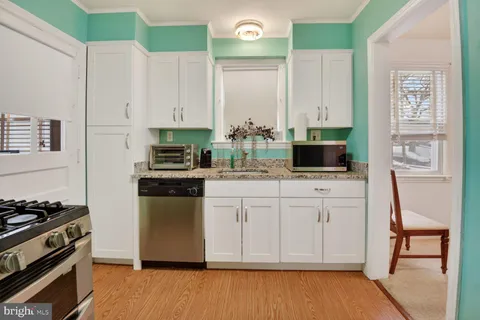 a view of a dining room with furniture and window
