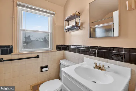 a bedroom with a bed and cabinets