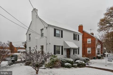 a front view of a houses with yard