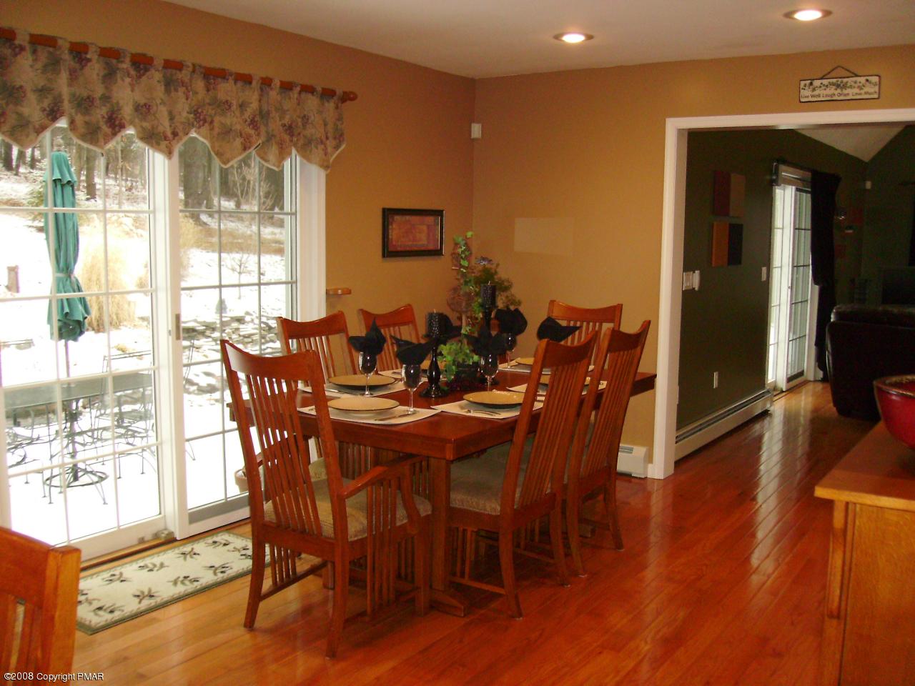 105 Quail Road Stroudsburg, PA 18360 - Photo 3 of 17 a view of a dining room with furniture and wooden floor