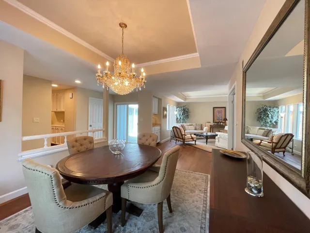 a dining room with table and chairs
