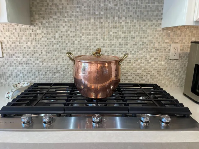 a bedroom with a bed and a lamp