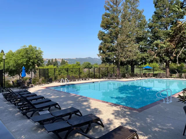 a view of backyard with sitting area
