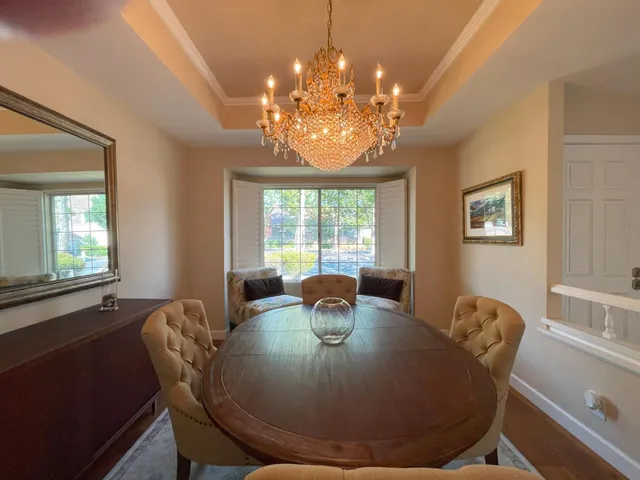 a large kitchen with a table and chairs