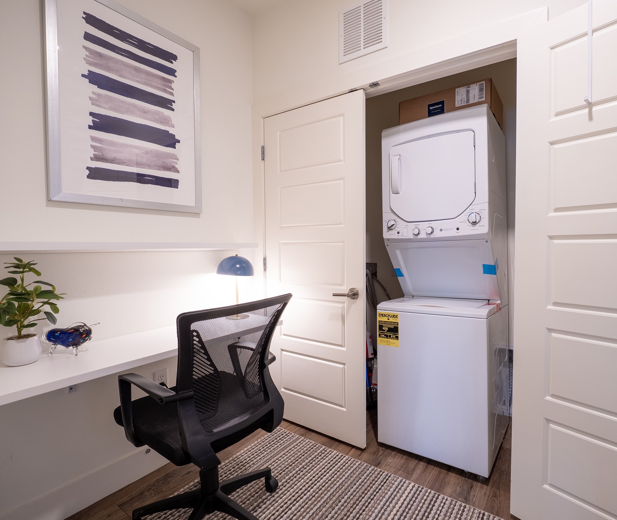 6444 Burnet Road, Unit 509 Austin, TX 78757 - Photo 5 of 32 Functional workspace with built-in desk and nearby stacked laundry for effortless multi-tasking.