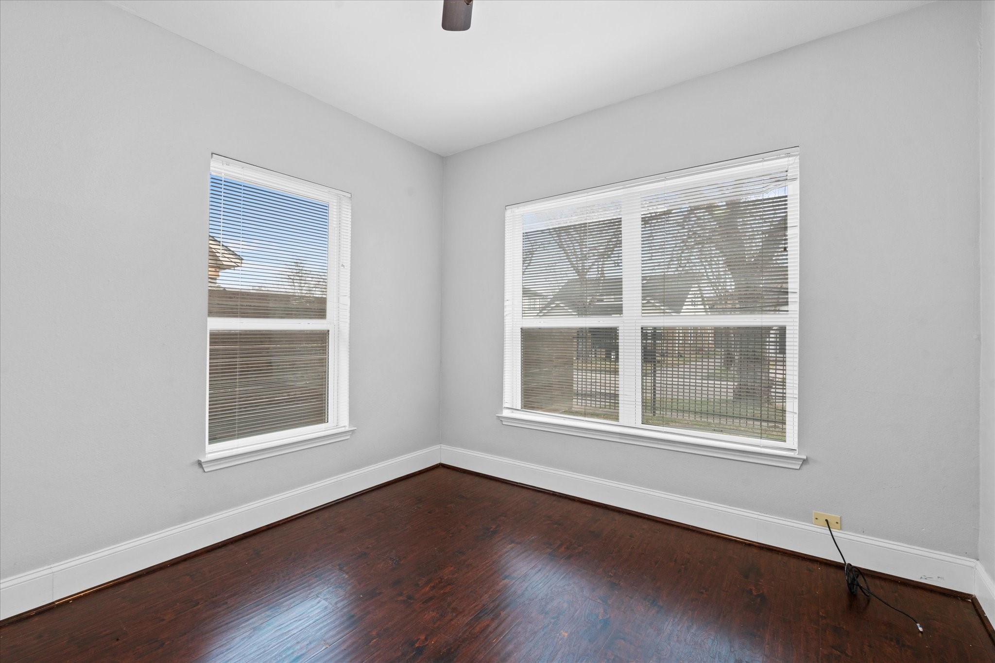 2614 Isabella Street Houston, TX 77004 - Photo 5 of 10 an empty room with wooden floor and windows