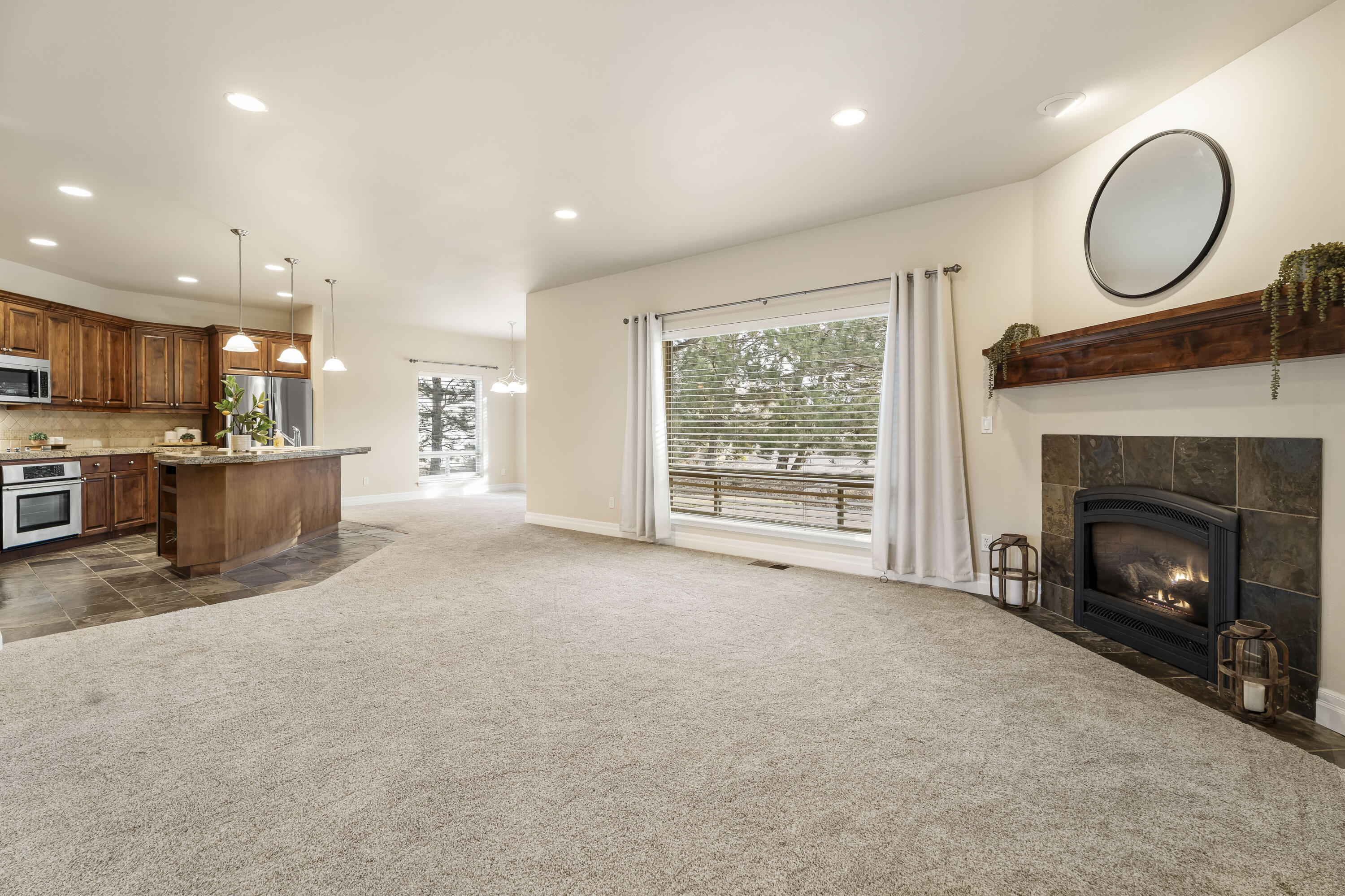 784 Ribbon Falls Road Redmond, OR 97756 - Photo 23 of 79 a view of kitchen with furniture and a fireplace