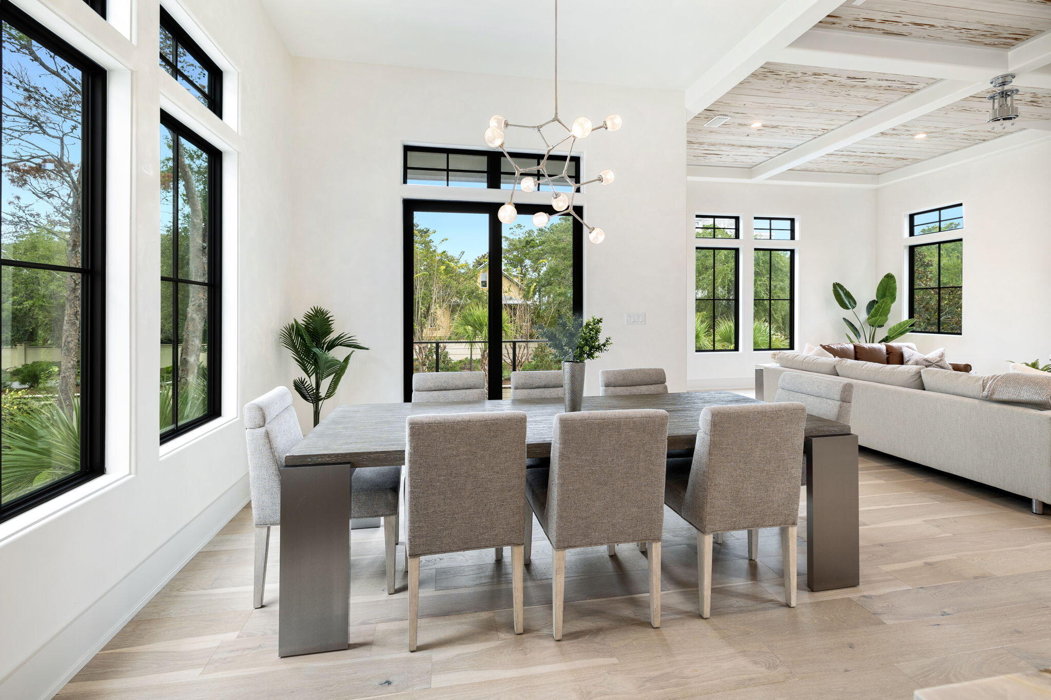 91 Grande Pointe Drive Inlet Beach, FL 32461 - Photo 9 of 51 a view of a dining room with furniture large windows and wooden floor