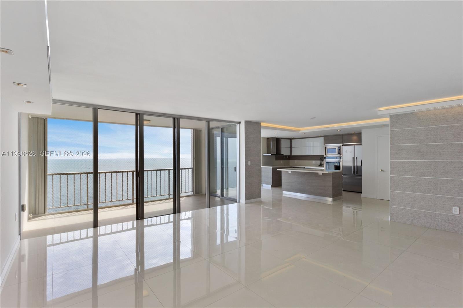 881 Ocean Drive, Unit 18F Key Biscayne, FL 33149 - Photo 1 of 12 a view of a kitchen with a sink and cabinets