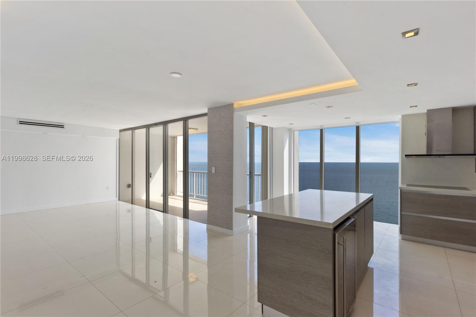881 Ocean Drive, Unit 18F Key Biscayne, FL 33149 - Photo 2 of 12 a very nice looking room with a large window and kitchen view