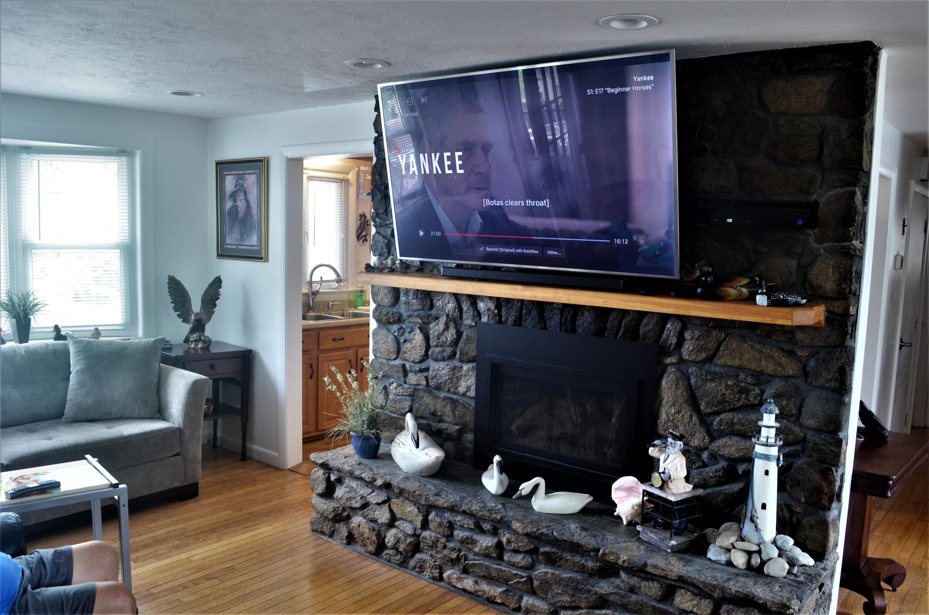 3 Wenonah Road Buzzards Bay, MA 02532 - Photo 11 of 25 a living room with furniture a fireplace and a window