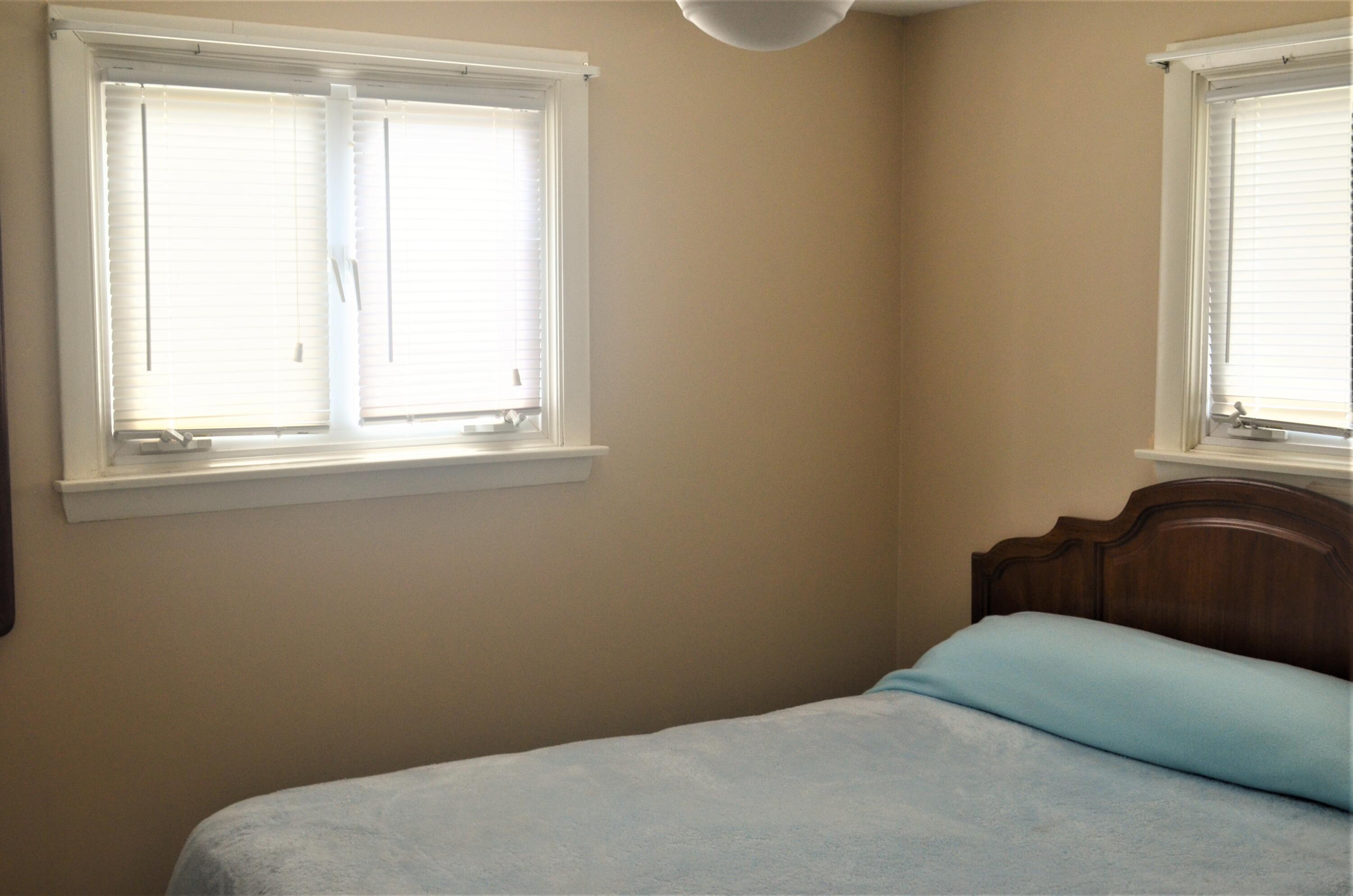 3 Wenonah Road Buzzards Bay, MA 02532 - Photo 15 of 25 a bedroom with a bed window and mirror
