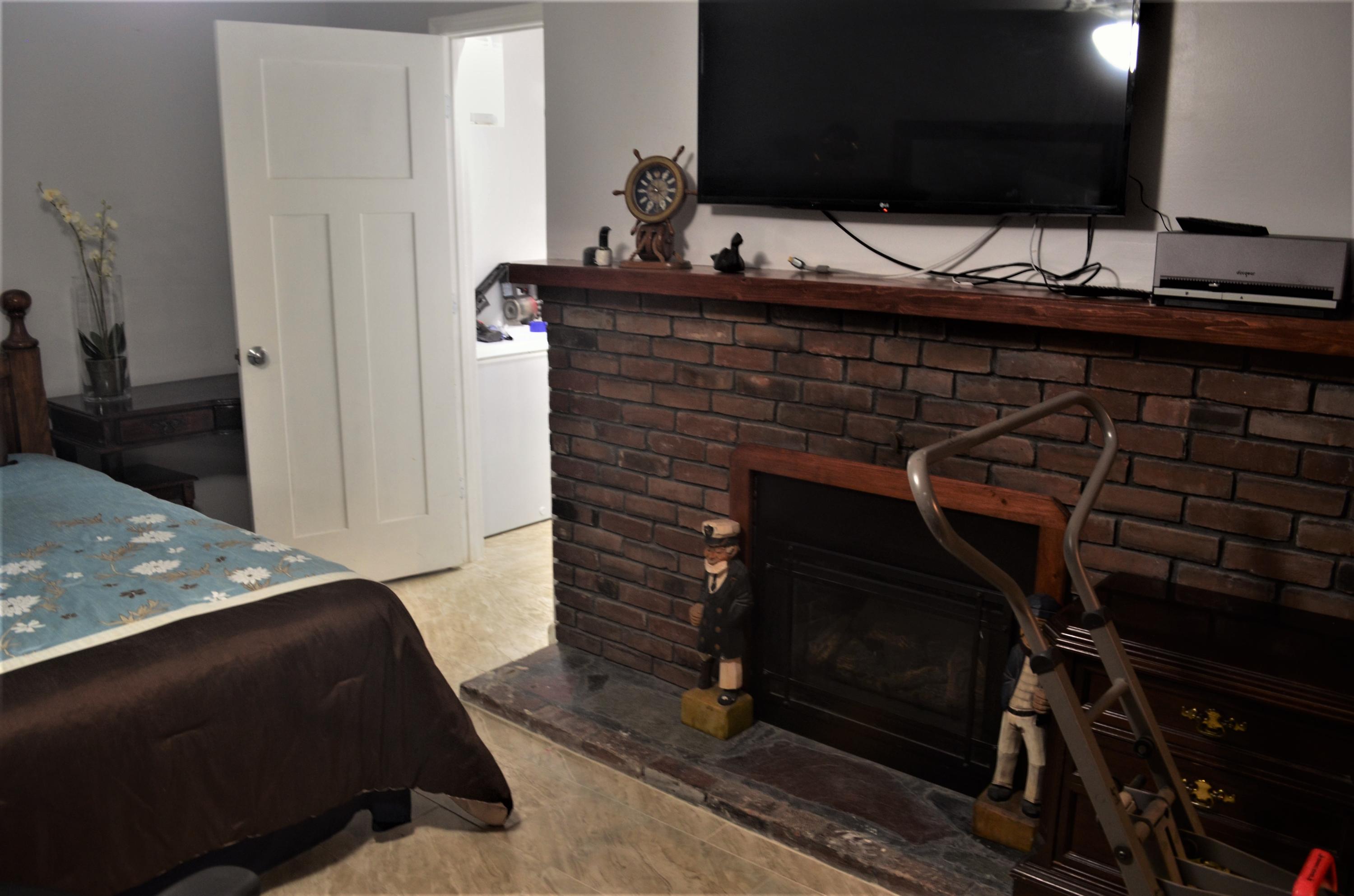 3 Wenonah Road Buzzards Bay, MA 02532 - Photo 20 of 25 a view of an empty room with wooden floor and staircase