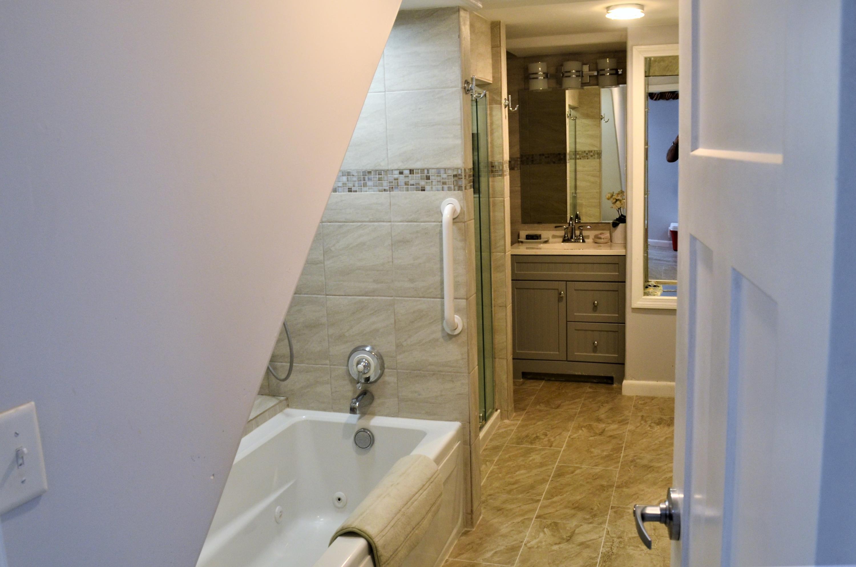 3 Wenonah Road Buzzards Bay, MA 02532 - Photo 21 of 25 a bathroom with a tub sink and mirror