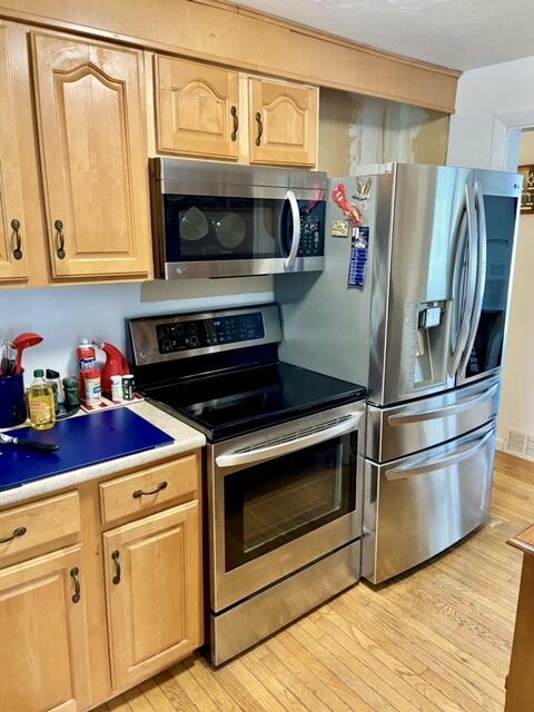 3 Wenonah Road Buzzards Bay, MA 02532 - Photo 10 of 25 a kitchen with stainless steel appliances granite countertop a stove microwave and refrigerator