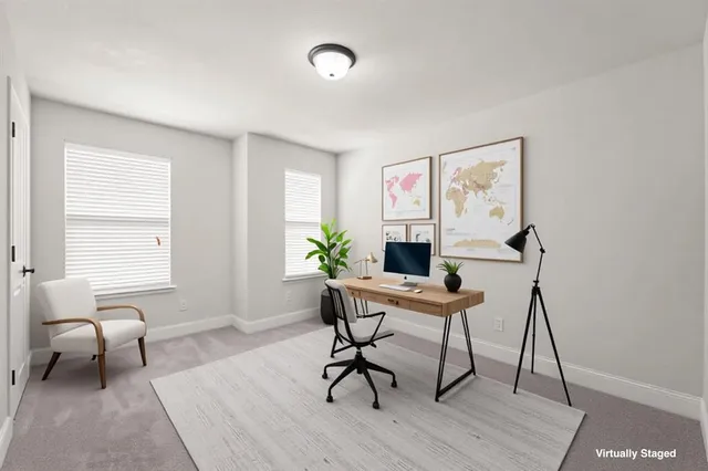 a workspace with furniture and a window