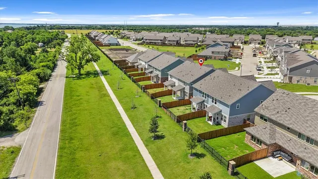 a view of a swimming pool with an outdoor seating and a yard