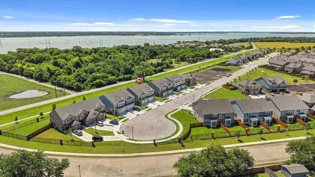an aerial view of a swimming pool with an outdoor seating