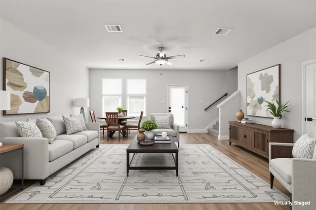 a living room with furniture and a rug