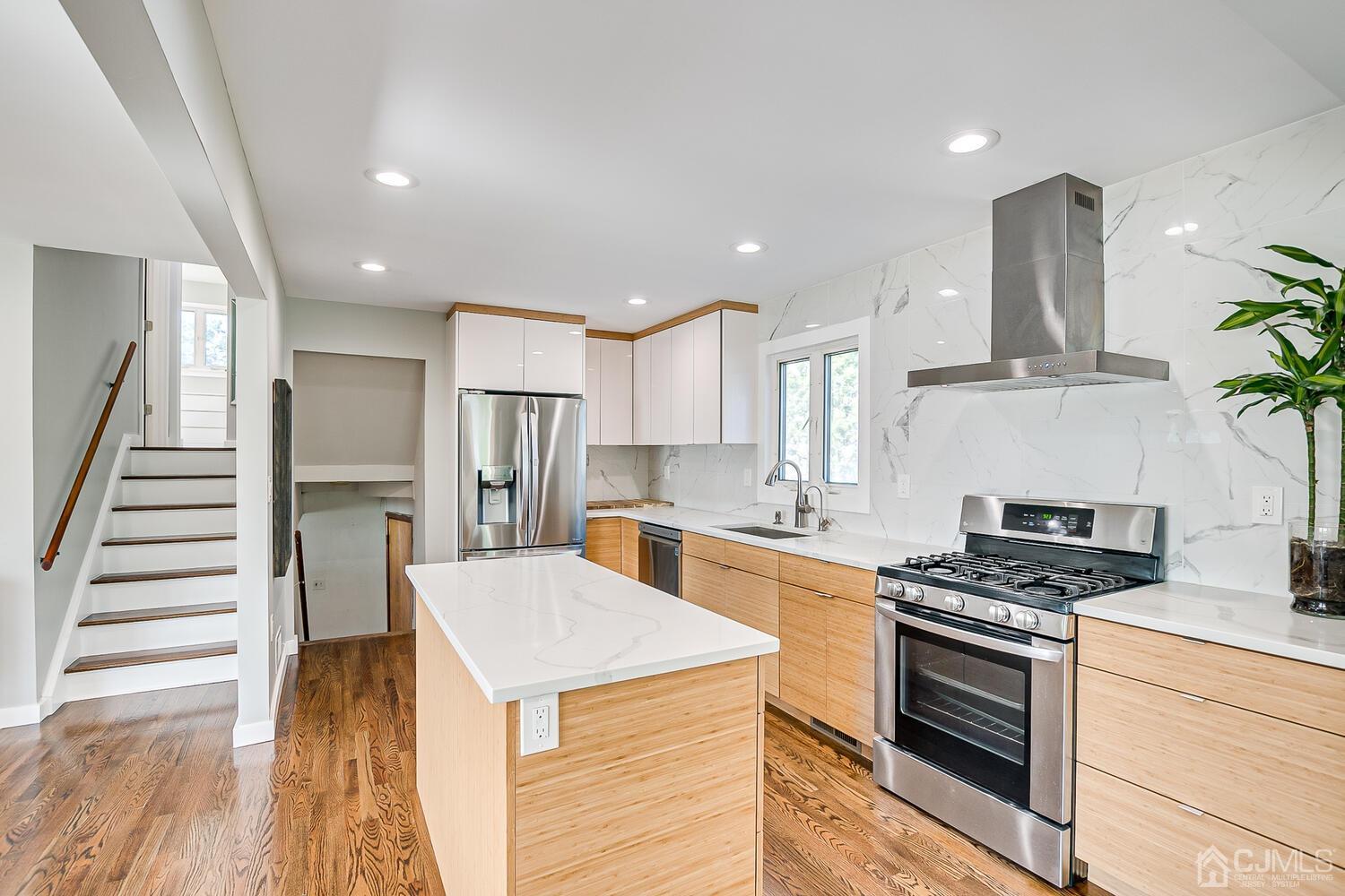 5 Leland Road Edison, NJ 08817 - Photo 15 of 48 a kitchen with stainless steel appliances kitchen island granite countertop a stove and a refrigerator