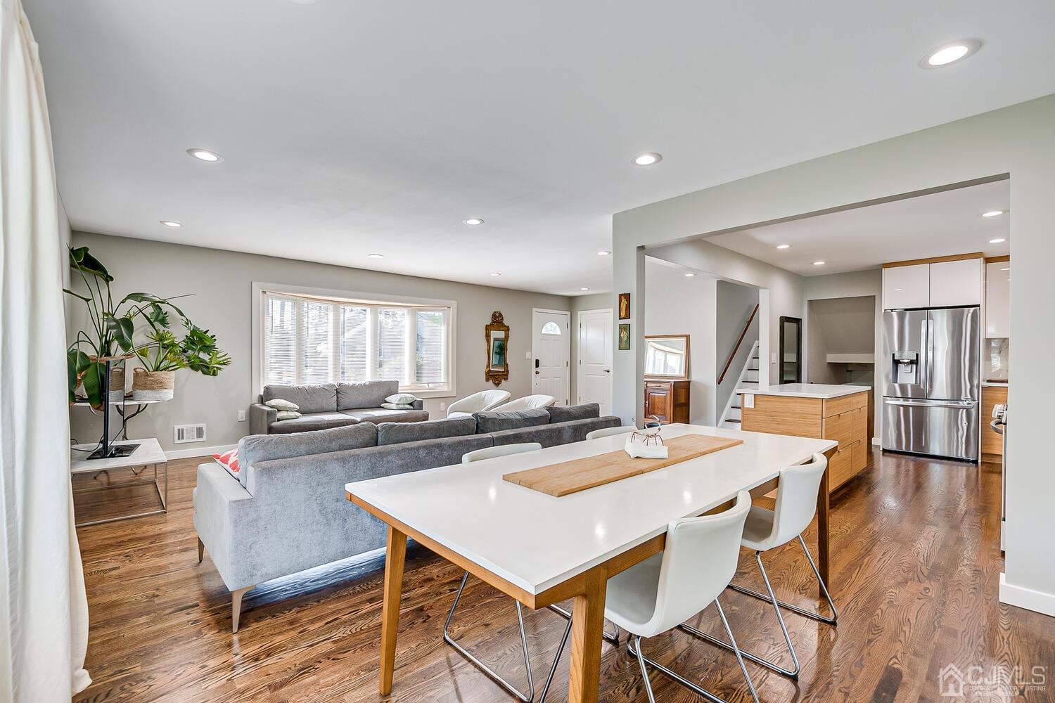 5 Leland Road Edison, NJ 08817 - Photo 18 of 48 a dining table with kitchen island and stainless steel appliances