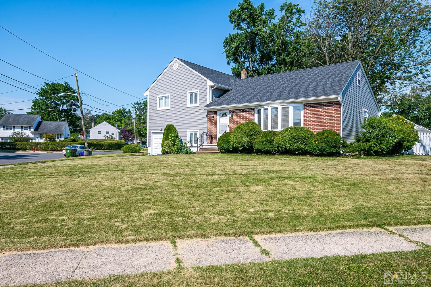 5 Leland Road Edison, NJ 08817 - Photo 2 of 48 a front view of a house with garden