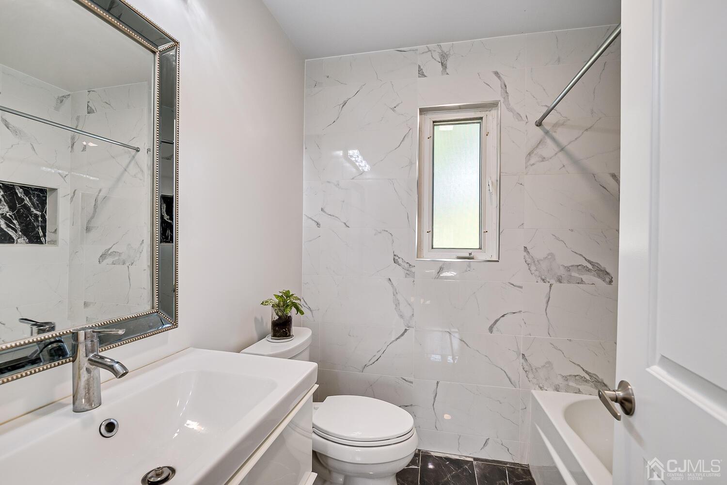 5 Leland Road Edison, NJ 08817 - Photo 30 of 48 a bathroom with a sink toilet and shower