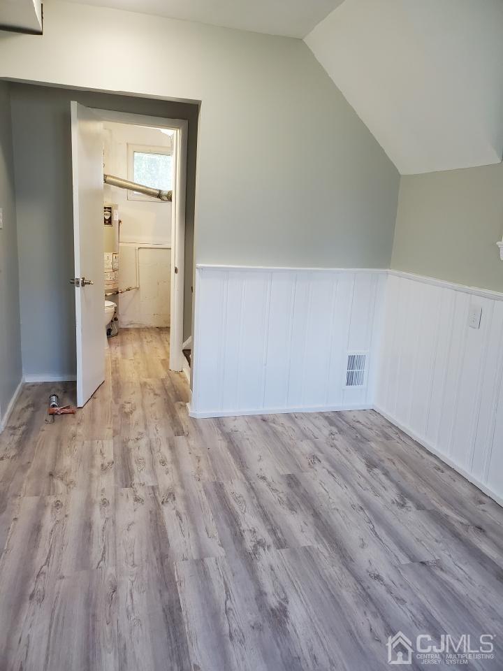 5 Leland Road Edison, NJ 08817 - Photo 31 of 48 a view of a room with wooden floor and a bathroom