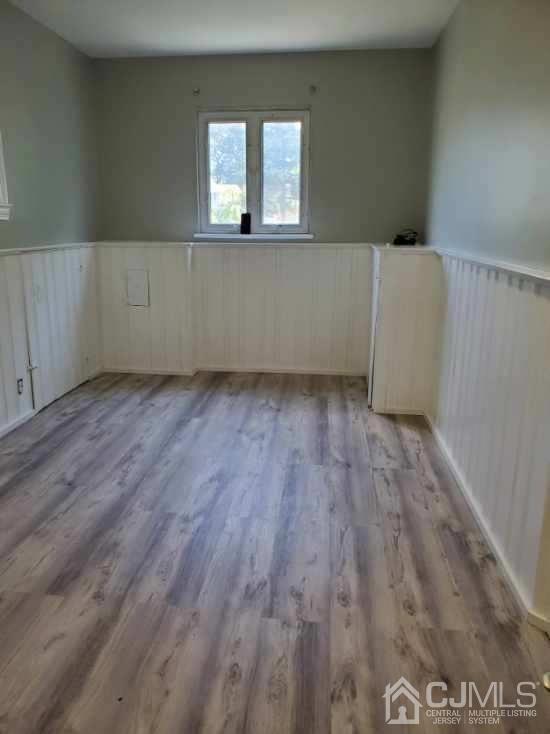 5 Leland Road Edison, NJ 08817 - Photo 33 of 48 a view of an empty room with wooden floor and a window