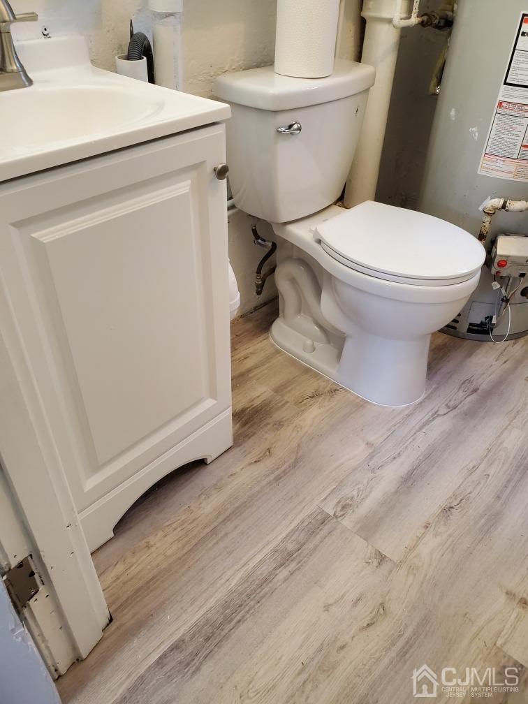 5 Leland Road Edison, NJ 08817 - Photo 34 of 48 a white toilet sitting next to a white toilet and a sink