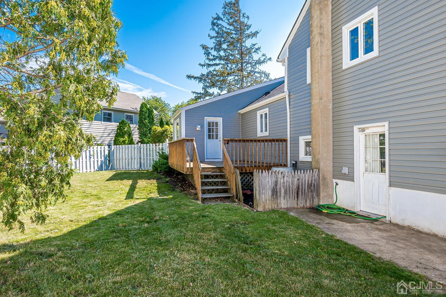 5 Leland Road Edison, NJ 08817 - Photo 40 of 48 a view of a house with a patio and a yard