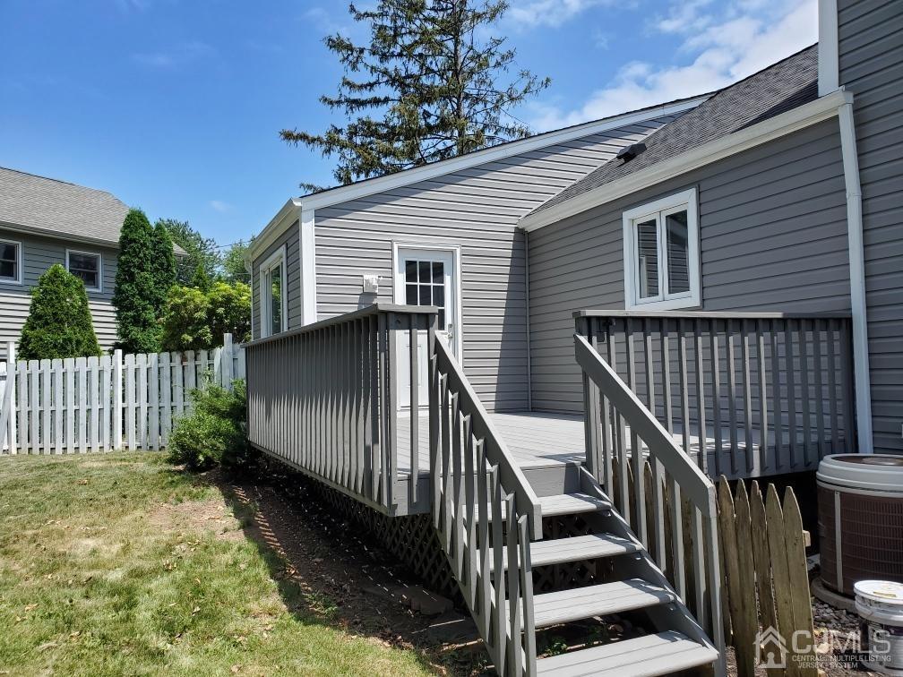 5 Leland Road Edison, NJ 08817 - Photo 42 of 48 a view of backyard with deck and wooden floor