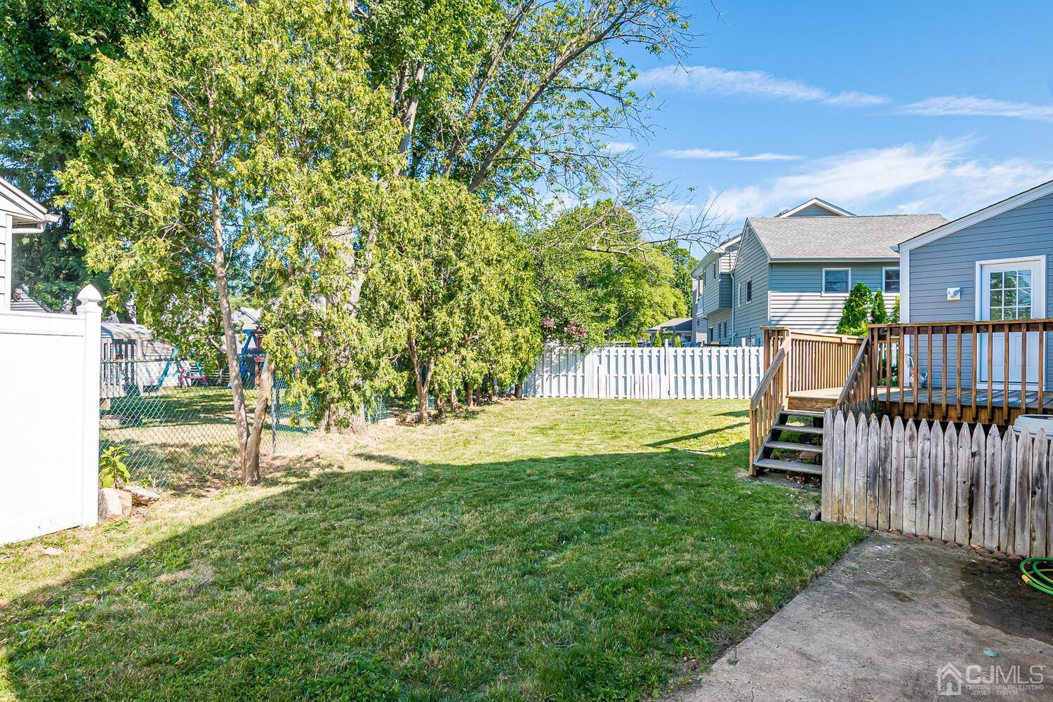 5 Leland Road Edison, NJ 08817 - Photo 43 of 48 a view of a house with backyard and a tree