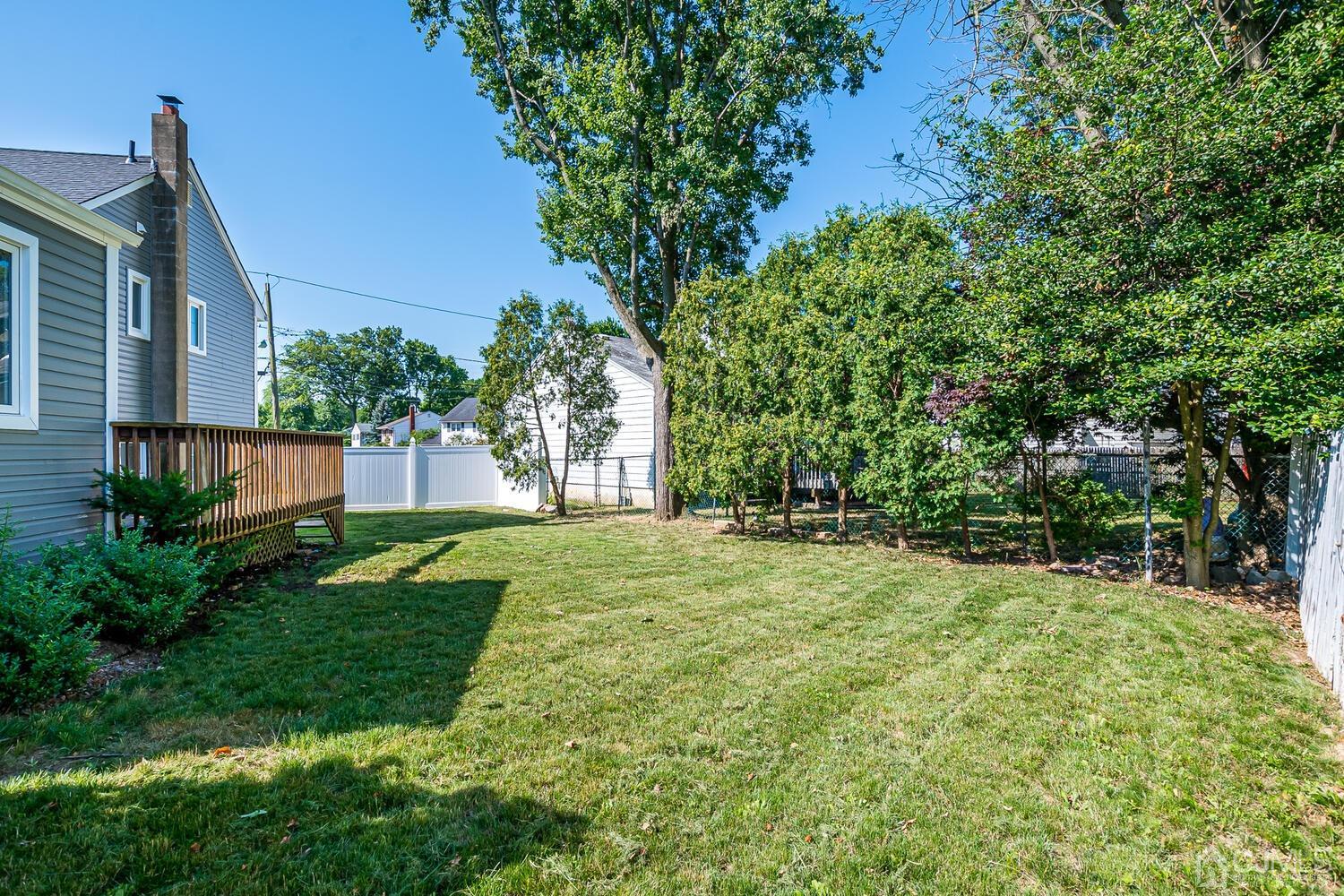 5 Leland Road Edison, NJ 08817 - Photo 44 of 48 a view of a backyard with large trees