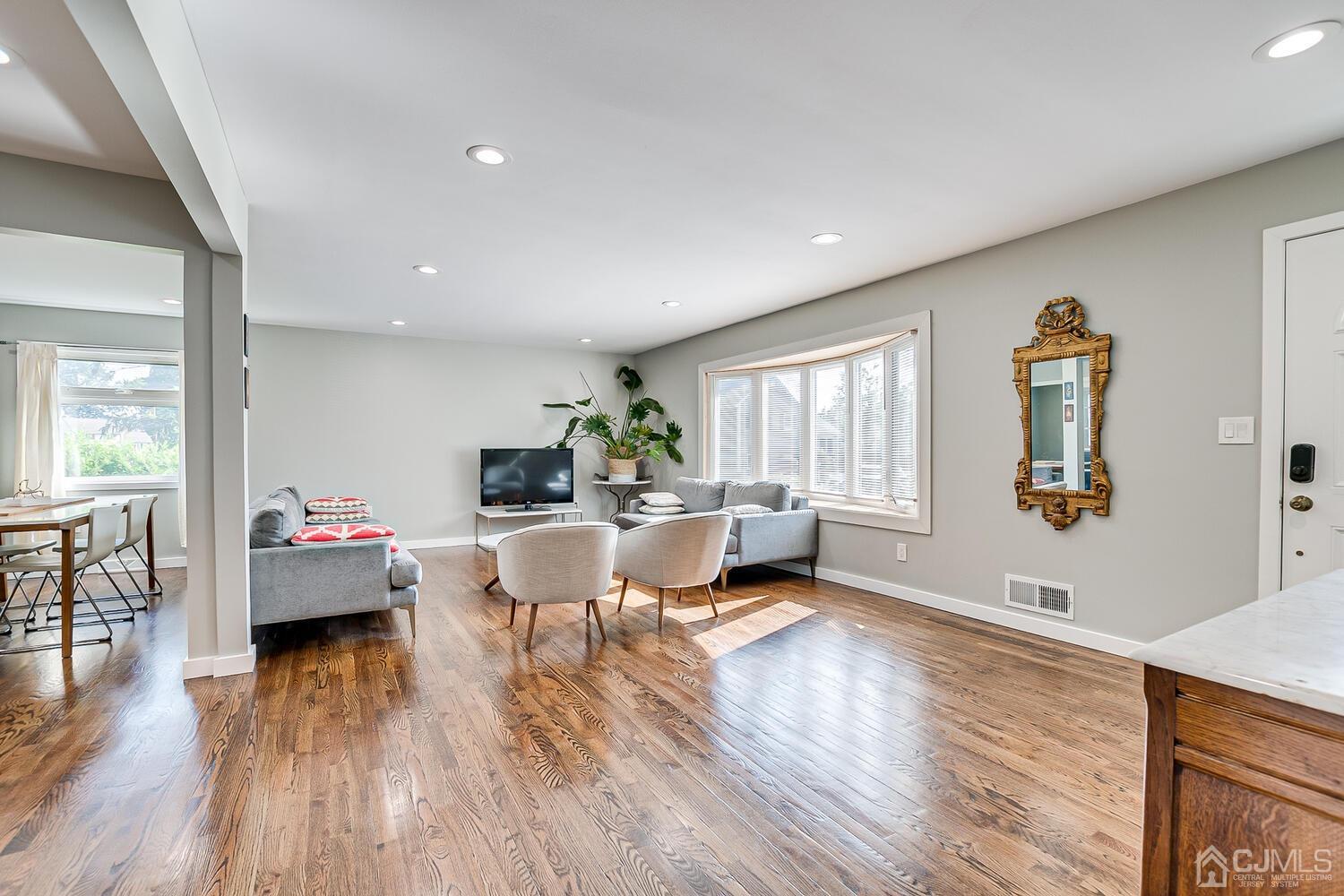 5 Leland Road Edison, NJ 08817 - Photo 8 of 48 a living room with furniture and wooden floor