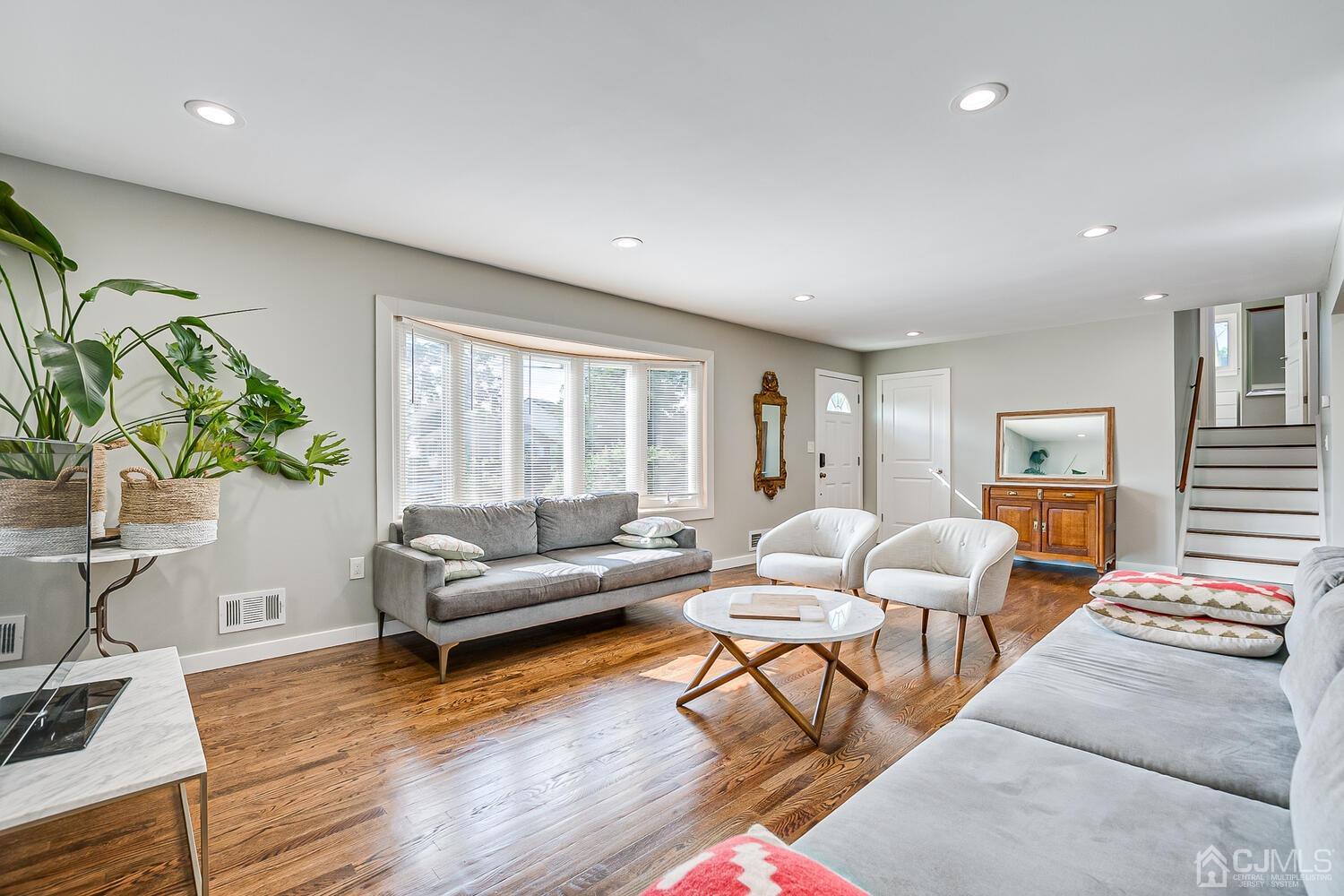 5 Leland Road Edison, NJ 08817 - Photo 9 of 48 a living room with furniture and wooden floor