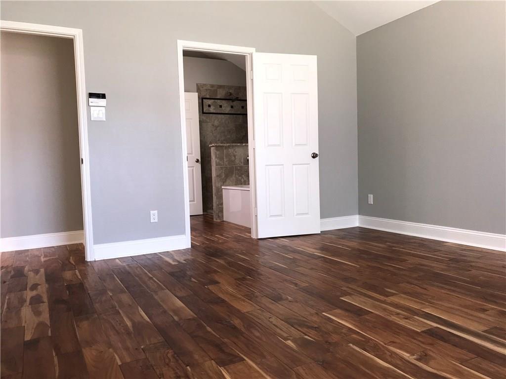 2012 Piper Drive Corinth, TX 76210 - Photo 13 of 27 a view of an empty room with wooden floor and closet