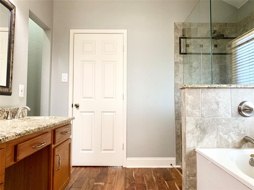 2012 Piper Drive Corinth, TX 76210 - Photo 17 of 27 a bathroom with a sink and a mirror