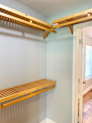 a view of a room with racks on the wall