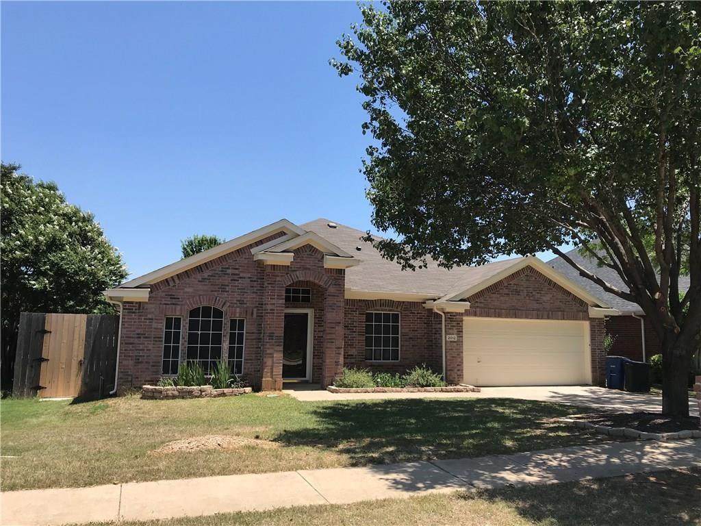 2012 Piper Drive Corinth, TX 76210 - Photo 3 of 27 a front view of a house with a yard and garage