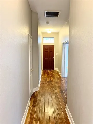 a view of a bedroom from a hallway